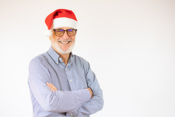 happy cheerful man in santa hat with arm crossed rejoicing at his retirement. Christmas concept.