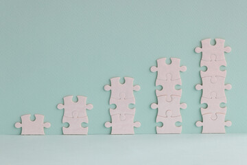 White puzzles in form of growing towers.