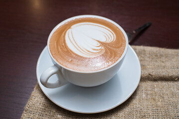 Delicious, aromatic and freshly made cappuccino with a pattern