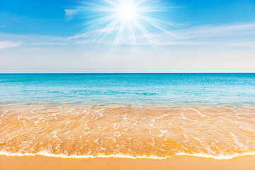 Fototapeta na wymiar Blue sea water and sand beach with blue sk