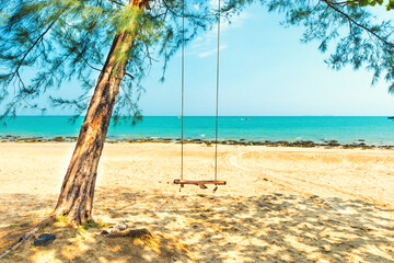 Swing on sand beach at tropical island. Tropical nature landscape