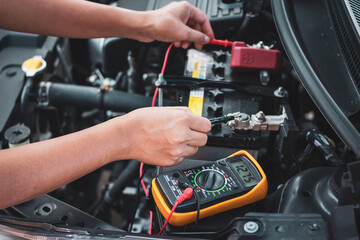 Fototapeta na wymiar Technician Hands of Maintenance car battery.