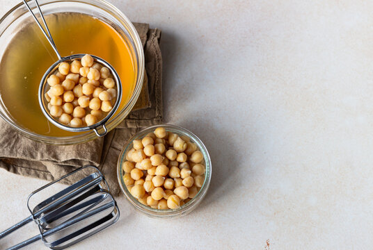 Boiled chickpea and aquafaba. Egg replacement for vegan recipe. Vegan cooking concept. Healthy product. Top view.