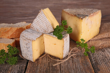 various cheese on wood background