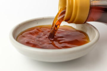 Anchovy fish sauce on white background