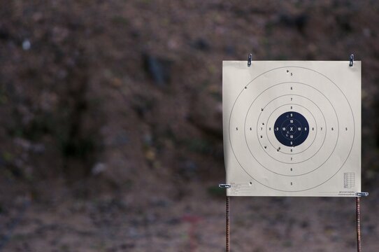 Goal setting with target, objectives and planning concept, top view, You can make a great target of business like a bullet target, gun and bullet holes on paper target