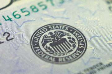 Stamp on a dollar banknote with an eagle and the words United states federal reserve system