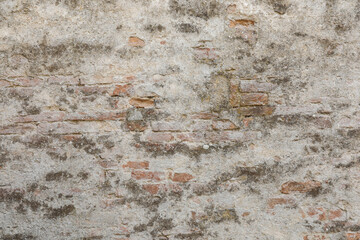 Old concrete brick wall with structure of white, grey and brown stones, stones background with space for text