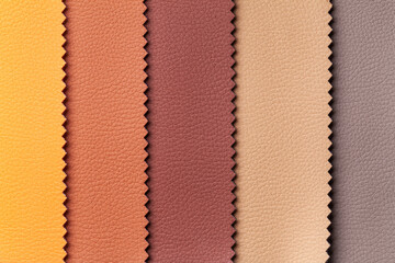 Swatch of leather textile brown and red colors, background.