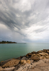 Wild weather and storm clouds above the Robe breakwater located in South Australia on November 11th 2020