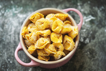 Raw Uncooked Cappelletti with flour