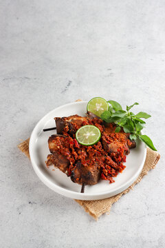 Sambal or penyet Ikan panggang or ikan manyung asap is ariidae fish preserved by fumigation sauce. Smoked ariidae fish sell in the traditional market in Indonesia.