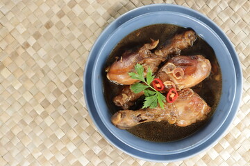 Semur ayam. Indonesian Homemade chicken with soy sauce, herb, and palm sugar,