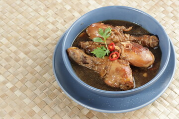 Semur ayam. Indonesian Homemade chicken with soy sauce, herb, and palm sugar,
