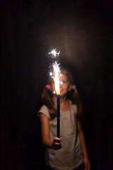 Little girl holding sparkler