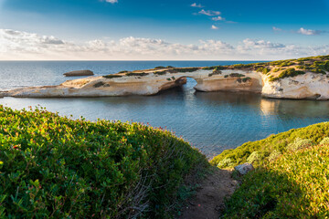 Limestone rock with arch, S'`Archittu di Santa Caterina in Oristano Province, Sardinia, Italy