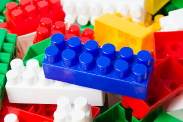 Many colorful cubes of blocks of the children's constructor. Child education and development concept