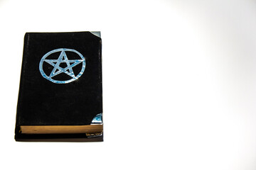 Occult grimoire, black magic book on the white background Empty copy space.
