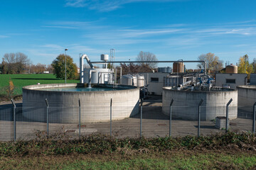 Large Circular Open-air Industrial Tank with Running Water Tap