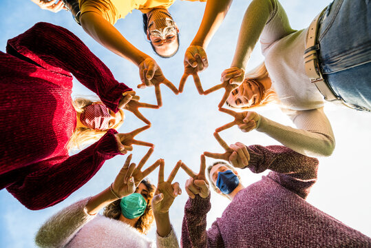 Group Of Young People Support Each Other Against Coronavirus - New Normal Lifestyle Concept Of Friends With Face Mask Outdoor.