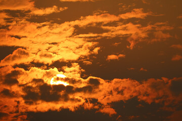 beautiful sunset red orange yellow silhouette dark sky in back on cloud
