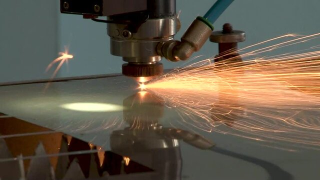 Technological process of laser cutting of metal sheet from titanium alloys on installation. Close-up. Aviation. Repair of gas turbine engines. 