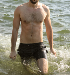 Young man body in sea water