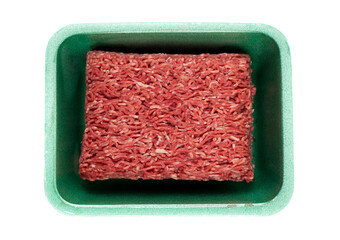 Top view of a green tray with ground beef. Studio photo isolated on white background.