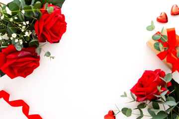 Roses and eucalyptus on white background. Valentine's Day concept, copy space