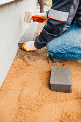 Laying stone tiles on the foundation area around the perimeter of the house - rainwater drainage -...
