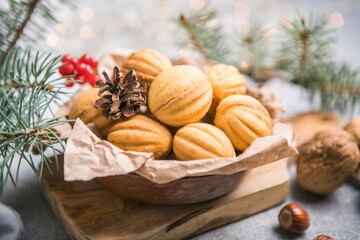 Chriatmas food. Shortbread russian walnut shaped cookies Oreshki with caramel.Close-up