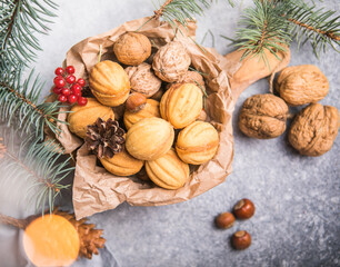 Chriatmas food. Shortbread russian walnut shaped cookies Oreshki with caramel.Close-up