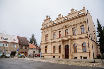 Fototapeta na wymiar Historical neo renaissance building of city hall at main town Husovo Square at cloudy autumn day, Cesky Brod, Central Bohemia, Czech Republic
