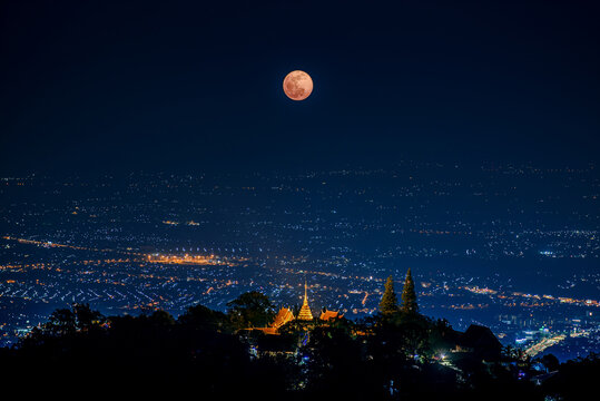 the Last Penumbral Lunar Eclipse in 2020 over Wat Phrathat Doi Suthep Temple , Chiang mai , Thailand