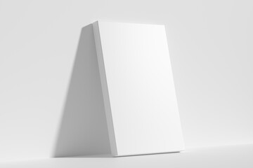 Rectangular poster on floor leaning at wall diagonal view