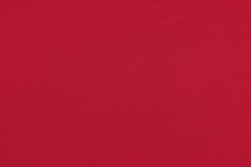 Red homogeneous background with a textured surface