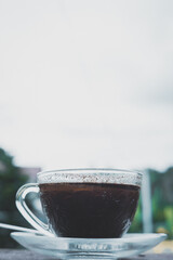 cup of coffee on wooden table