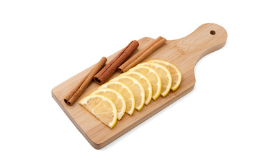 Lemon wedges and cinnamon sticks lie side by side on a cutting board. Isolated objects with shadows on a pure white background. Kitchen utensils and ingredients for cooking.
