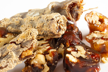 Walnuts on a string dipped in starch grape molasses. Churchkhela. Walnut sujuk.