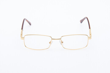 Fototapeta premium Fashion sunglasses golden frames on white background.