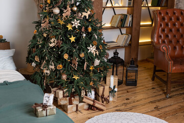 interior of the Christmas room with gifts under the spruce
