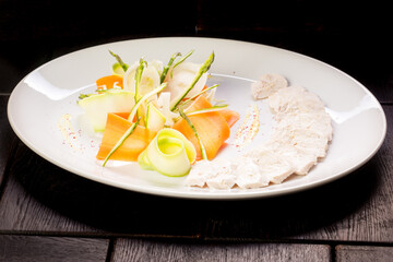 chicken fillet with vegetables on a white plate