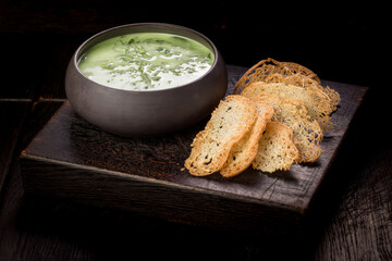 broccoli soup garnished with baguette croutons