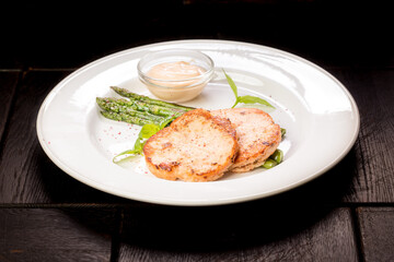 crab cutlets with asparagus and basil