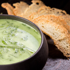 broccoli soup garnished with baguette croutons