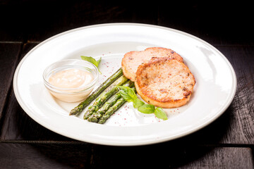 crab cutlets with asparagus and basil