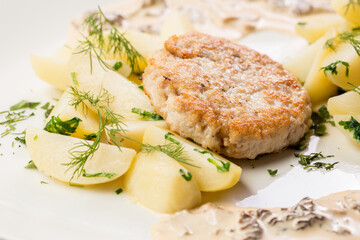 chicken cutlet with potato wedges ready-made dish for the menu