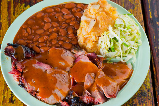 Pulled Pork. Barbecue Pork Platter Served With Classic Bbq Sides Mac N Cheese, Cornbread, Brussels Sprouts, Coleslaw And Beer. Classic Traditional Texas Meats And Side Dishes.