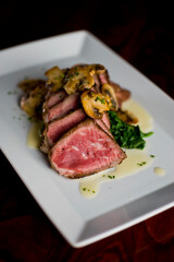 Steak and potatoes. Grade A grass fed angus beef steaks. Tenderloin, filet mignon, New York strip, bone in rib-eye grilled medium rare on outdoor wood-fired grill. Classic American steakhouse entree.