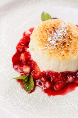 cheesecake garnished with strawberry jam